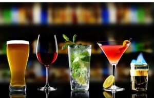 Glasses containing different types of alcoholic drinks. Here are some alcohol stocks to watch.