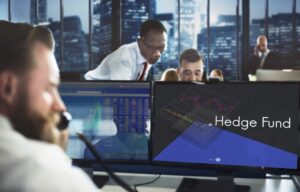 Traders at a hedge fund. A hedge fund is one class of alternative investments.