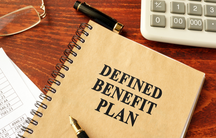 Notebook on a desk containing a defined benefit plan