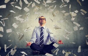 A business person meditating and trying to improve his financial mindset