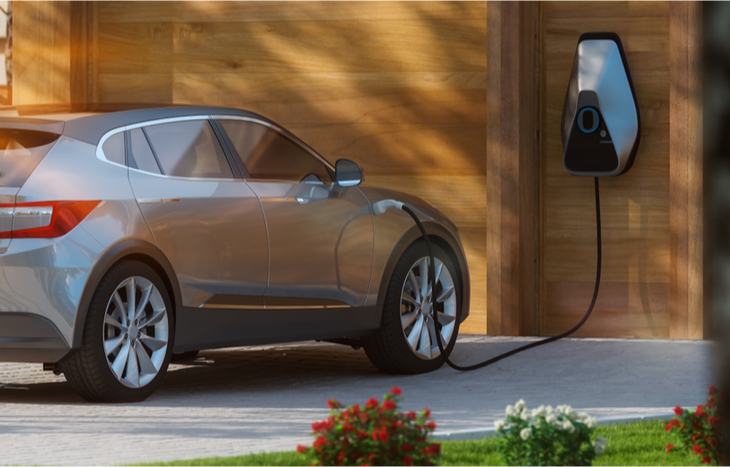 an electric car plugged in shows growing demand for ev stocks