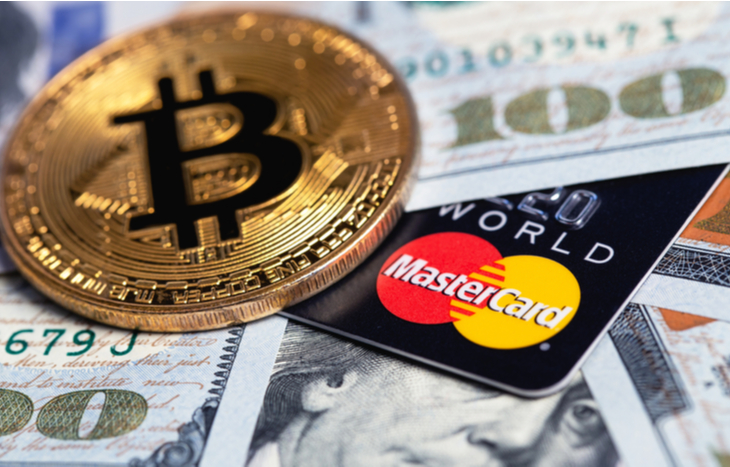 Mastercard and crypto sitting on fiat currency