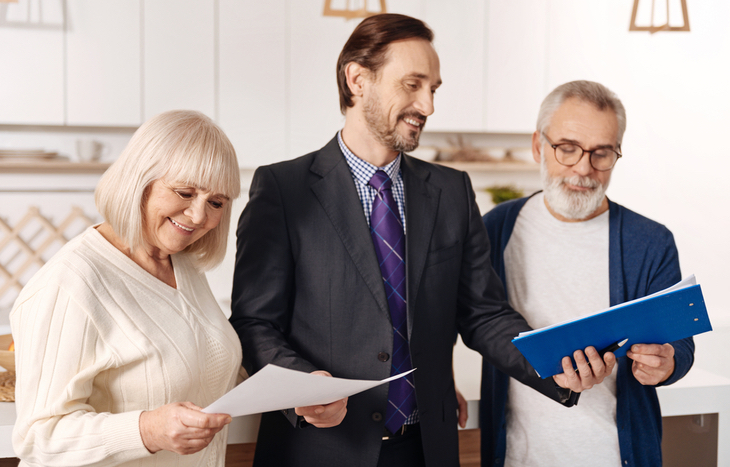 A man discussing early retirement considerations with his clients