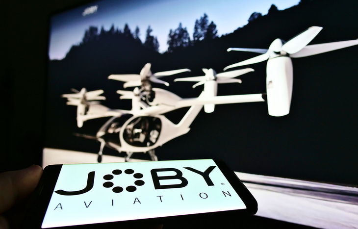 Joby Aviation stock gives investors the chance to invest in the leading eVTOL company whose logo and protoype are pictured.