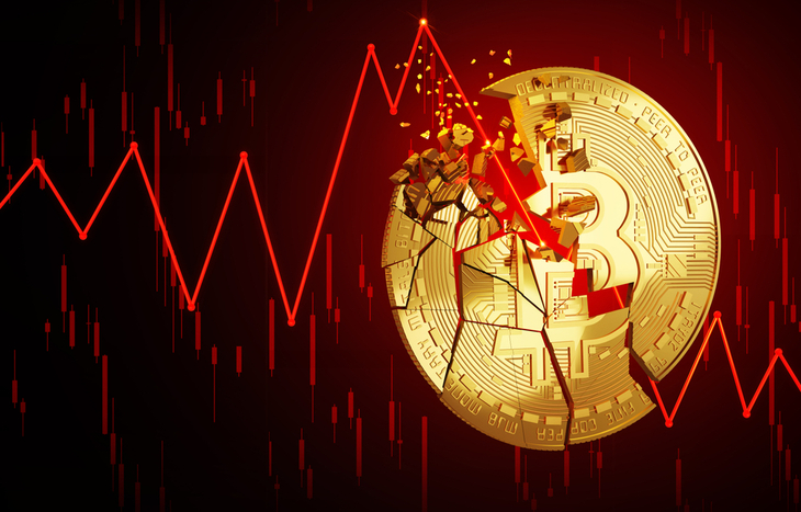a chart showing crypto crashing through an illustration of Bitcoin