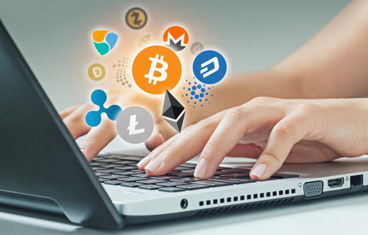 Someone looking for different types of cryptocurrencies on their laptop.