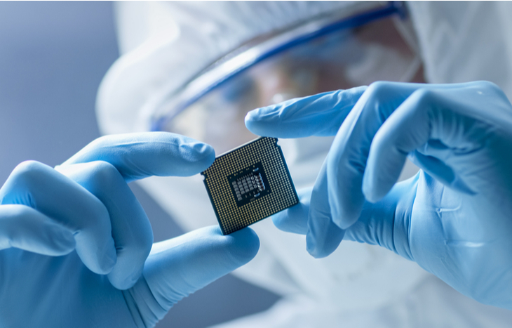 Microchip stocks researcher inspecting a chip